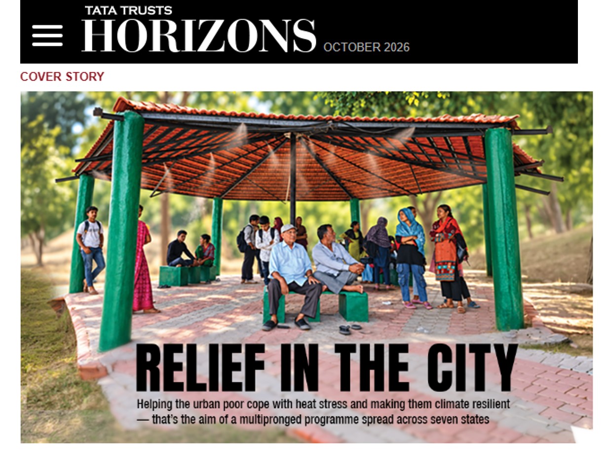 Citizens shelter at a ‘cooling station’ in Patan (Gujarat) that provides respite from the heat with overhead sprinklers